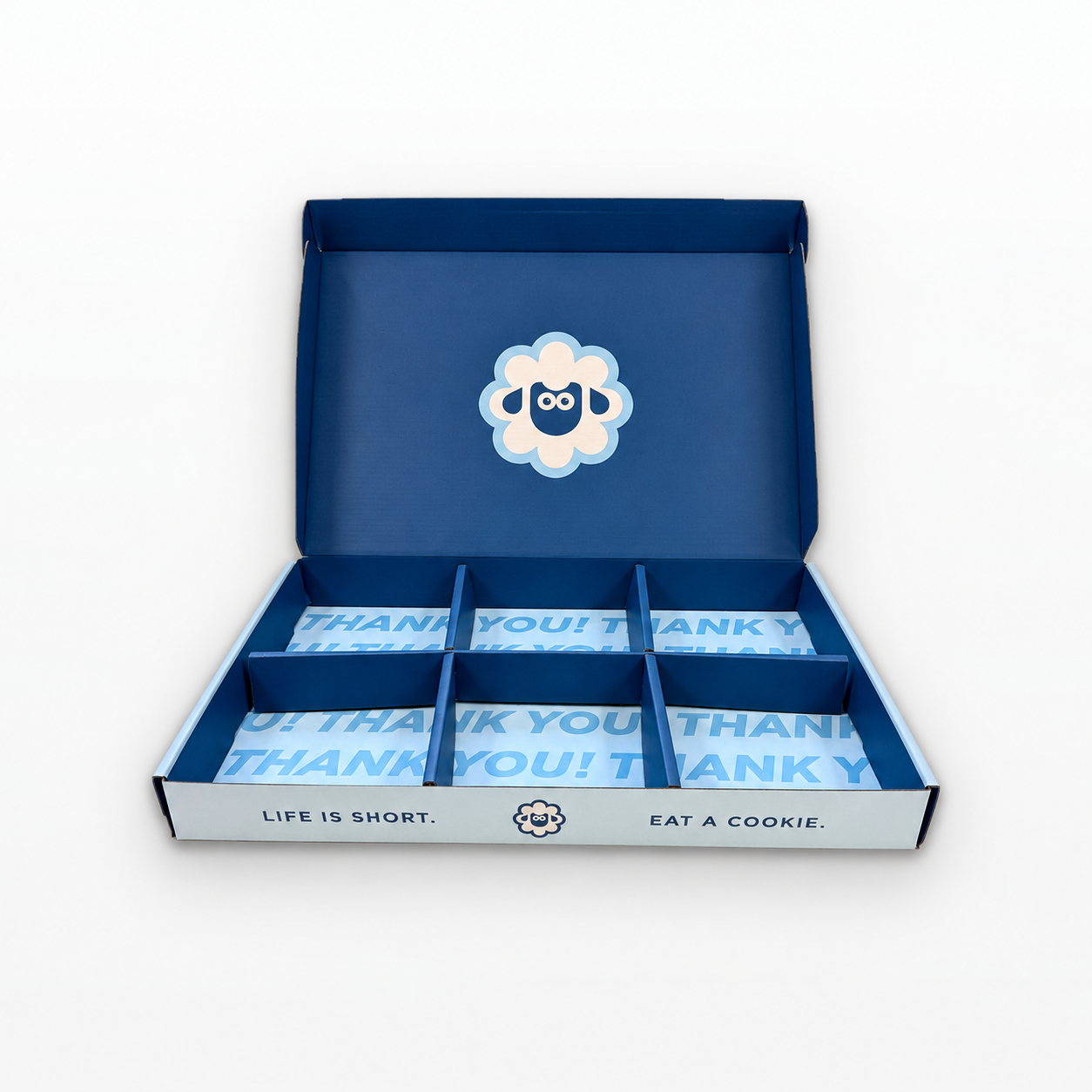 Open Frosted Sheep shipping box with cookies